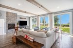Elevate Family Movie Nights in Blueberry Bluff`s Living Room - Complete with a Cozy Fireplace and Refreshing Outdoor Views